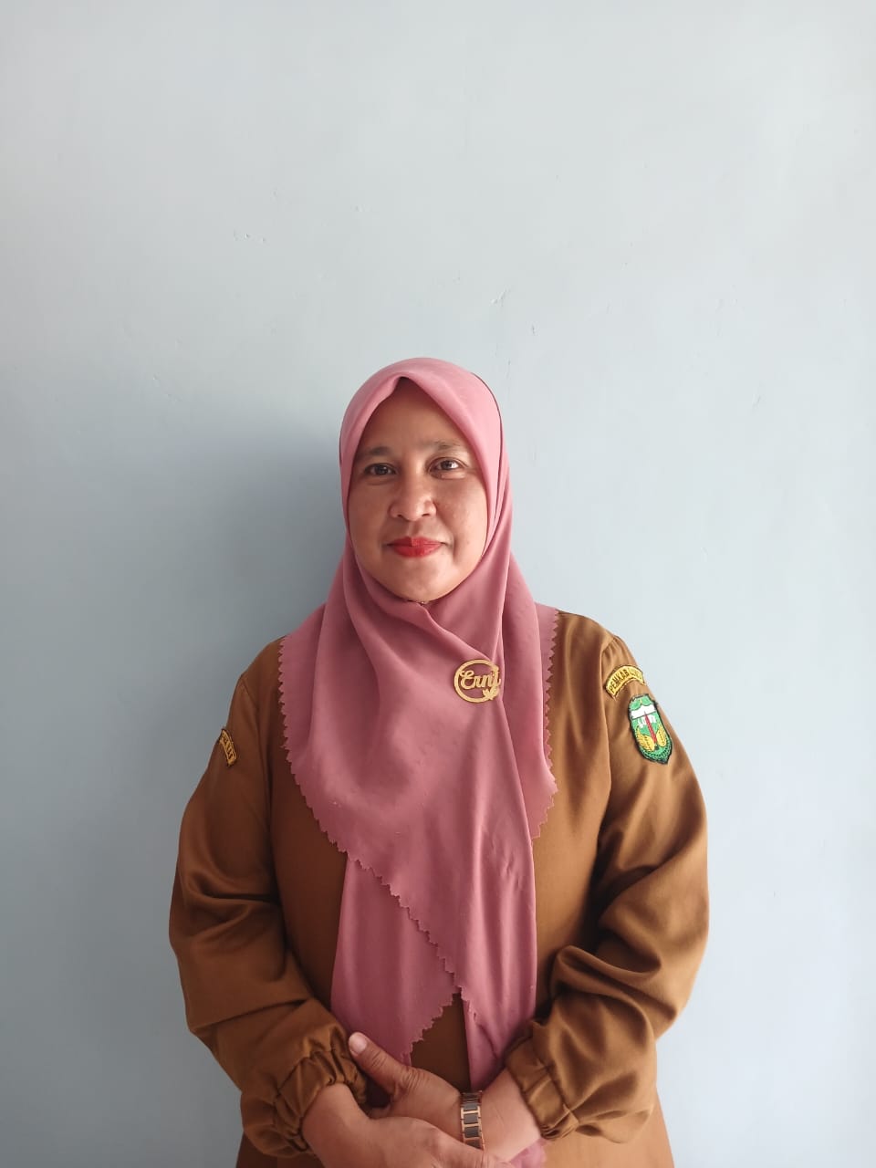 Erni Hasmuddin, S. Pd